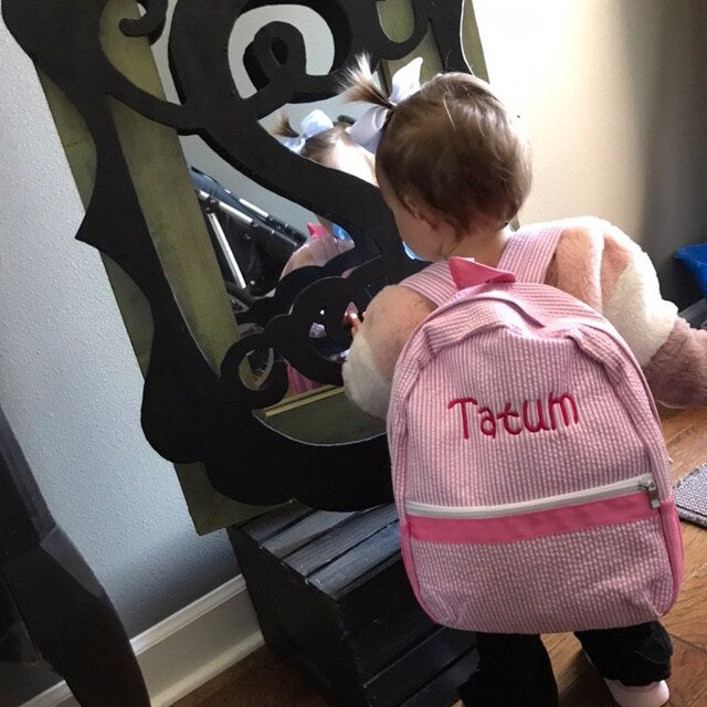 pink seersucker backpack with embroided name