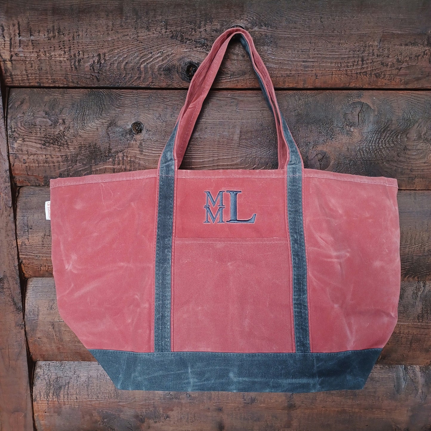 waxed canvas tote bag with embroidered monogram