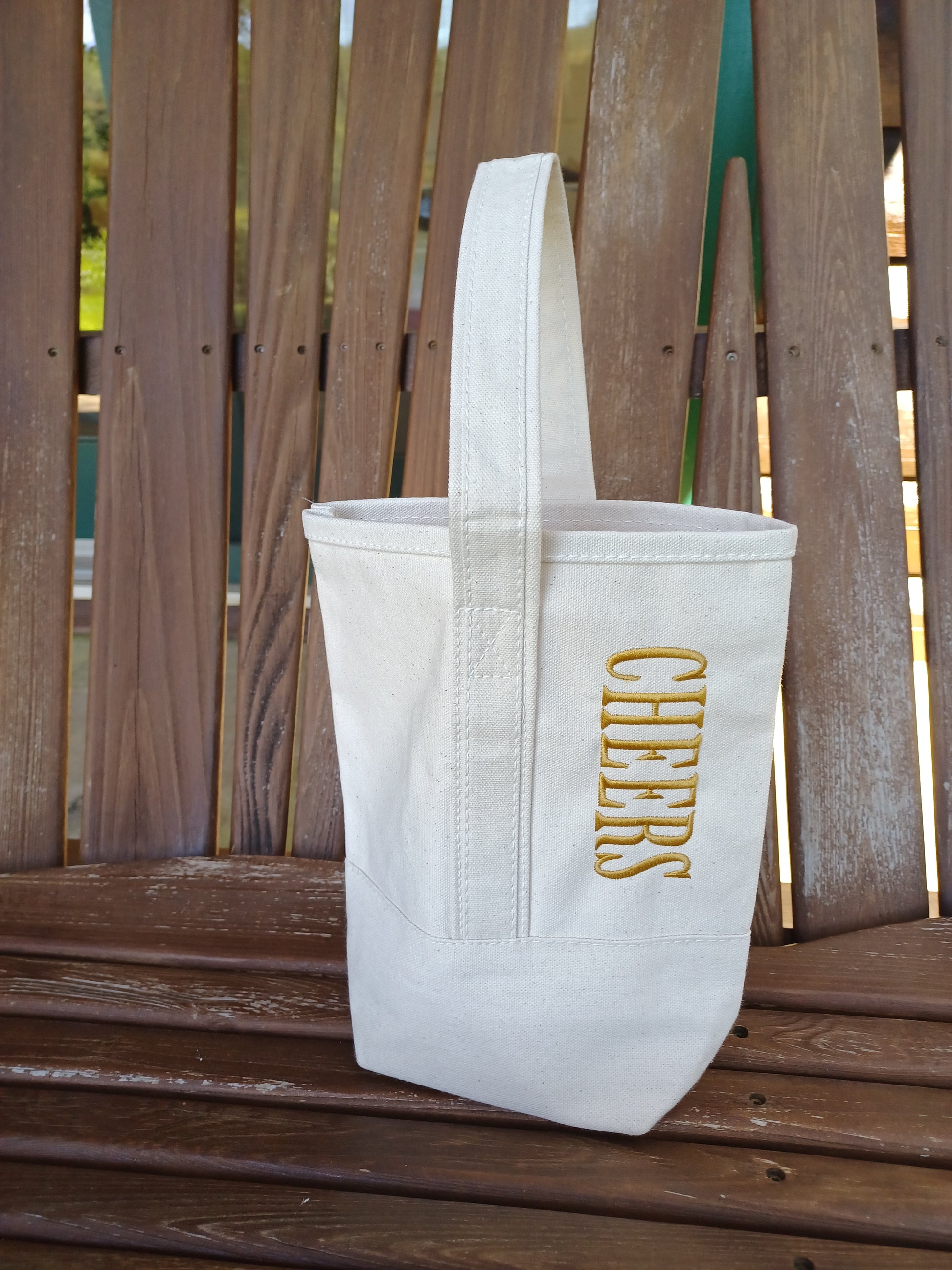 Natural Ivory Wine Tote Bag with the word CHEERS embroidered on it