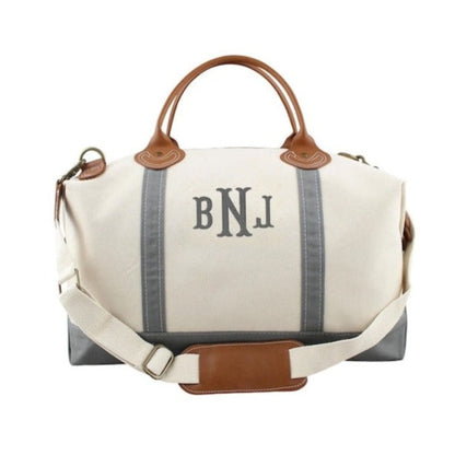 gray monogrammed weekender bag with leather handles