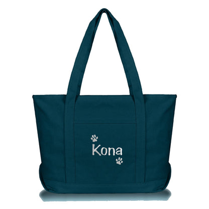 Blue tote bag embroidered with dog's name and a paw prints