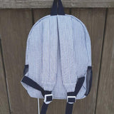 back of navy backpack for child